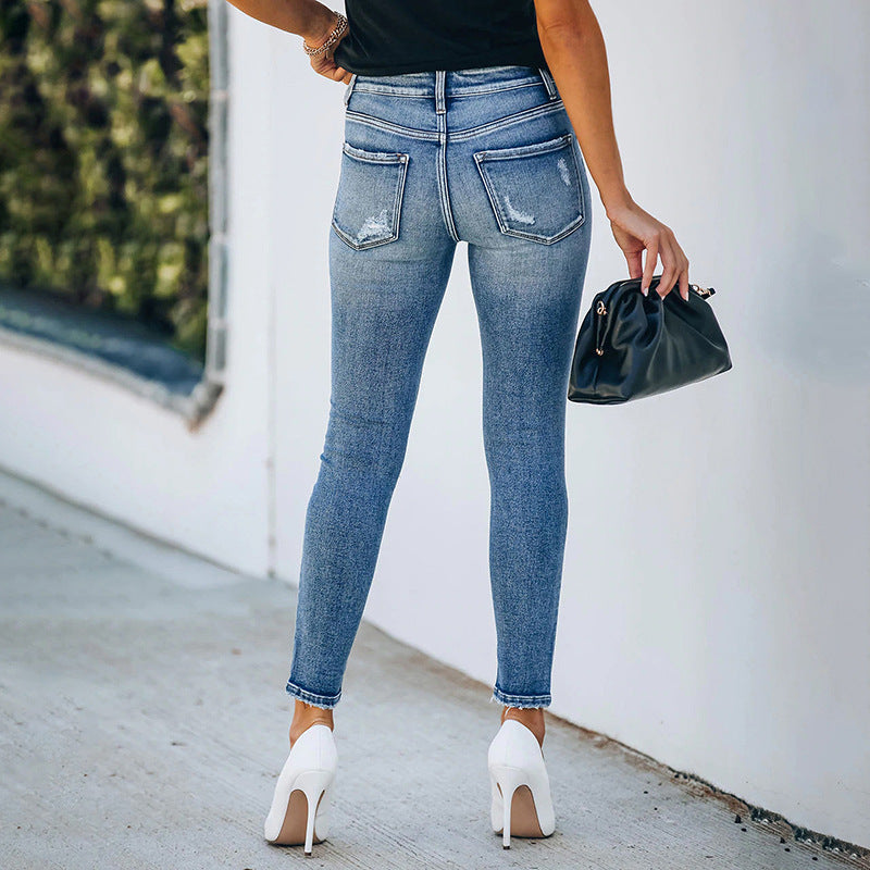 Pantalones vaqueros ceñidos rasgados