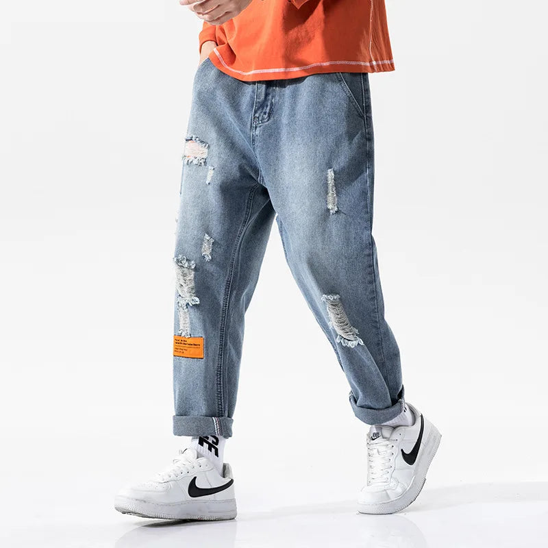 https://ae01.alicdn.com/kf/He26c2e5cded64ec897502effbae0cc46G/Kx-8801-moda-kentsel-erkekler-delik-kot-Hip-Hop-moda-Streetwear-gev-ek-t-m-ma.jpg